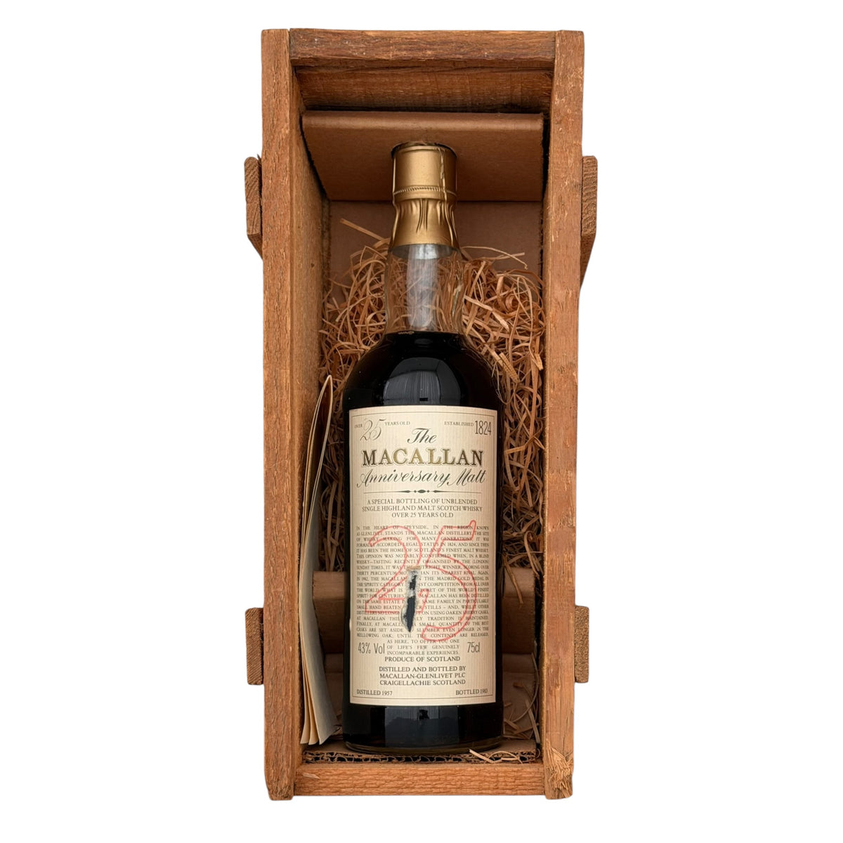 Macallan 1957 25 Year Old Anniversary Malt bottle in open wooden presentation crate